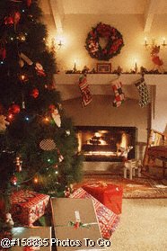 Christmas tree by fireplace